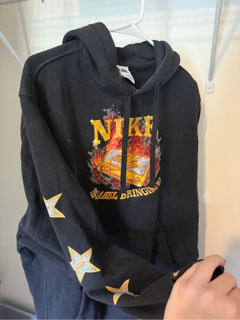 Nike Black Hoodie with Yellow and Orange Flame Graphic